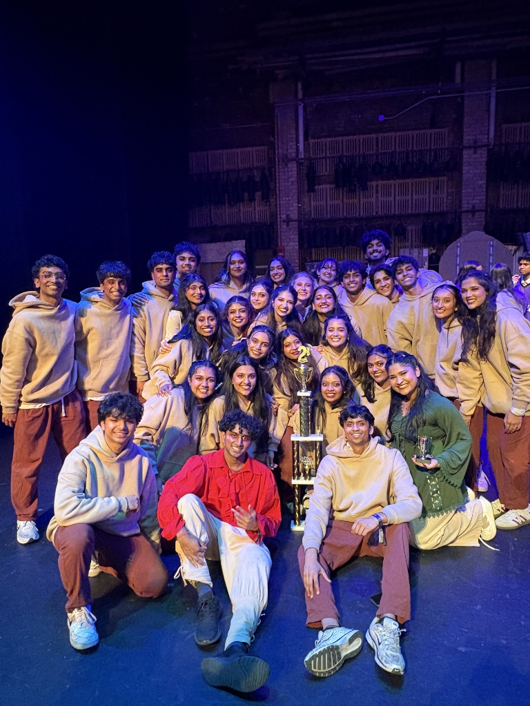 TAMU Akh Mastani team posing on stage with their 2nd place trophy