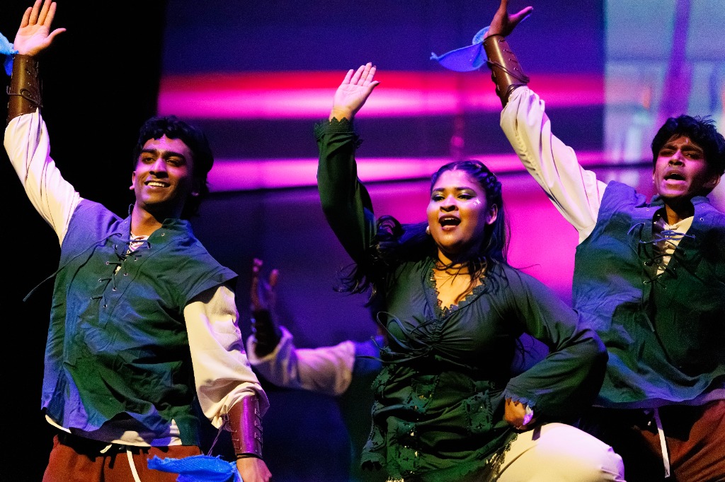 TAMU Akh Mastani dancers performing synchronization choreography on stage