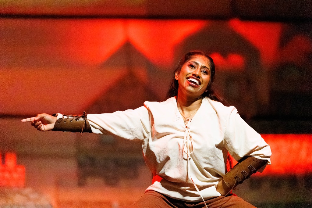 TAMU Akh Mastani dancer smiling and performing choreography
